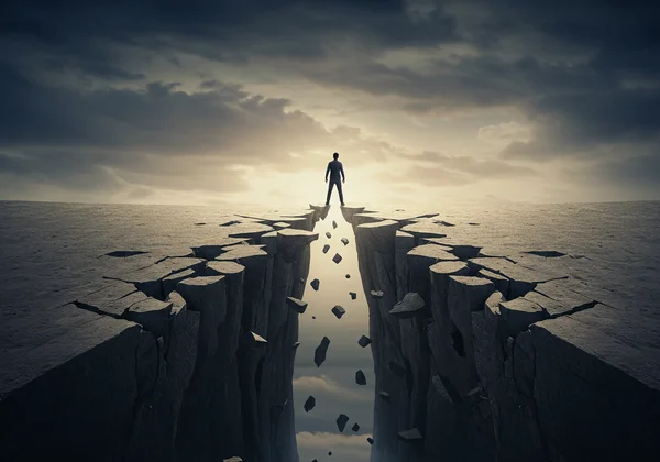 A person on a precarious, crumbling path, symbolizing risk